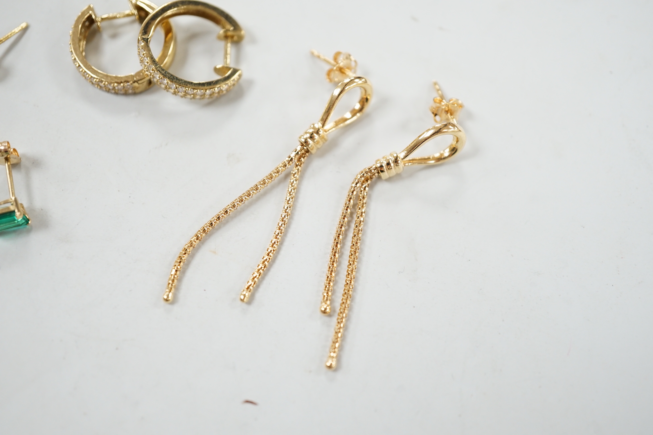 A modern pair of 18ct gold and collet set diamond ear studs, 5mm, two pairs of 9ct earrings (gross 4.5 grams) and a pair of 14k and green stone set ear studs.